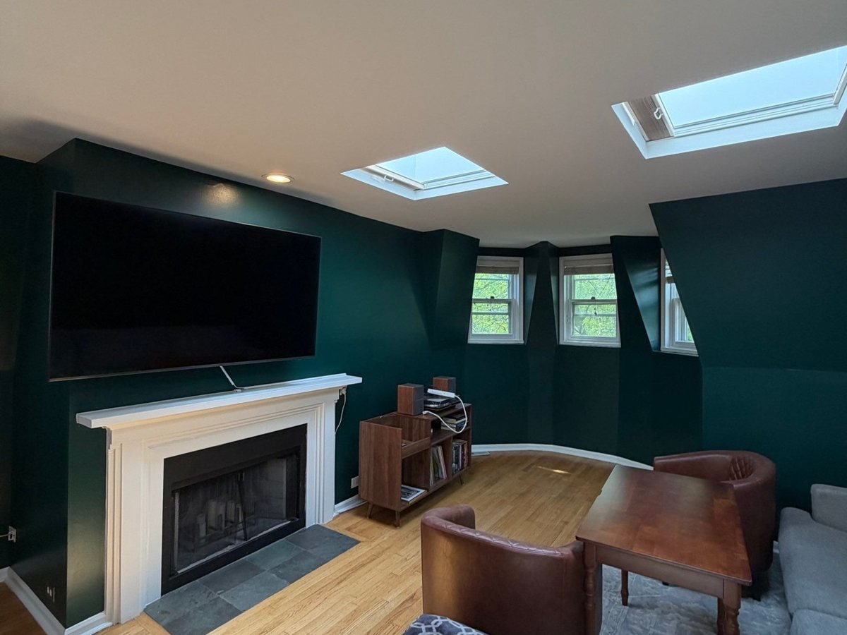 Emerald living room with fireplace and TV wall