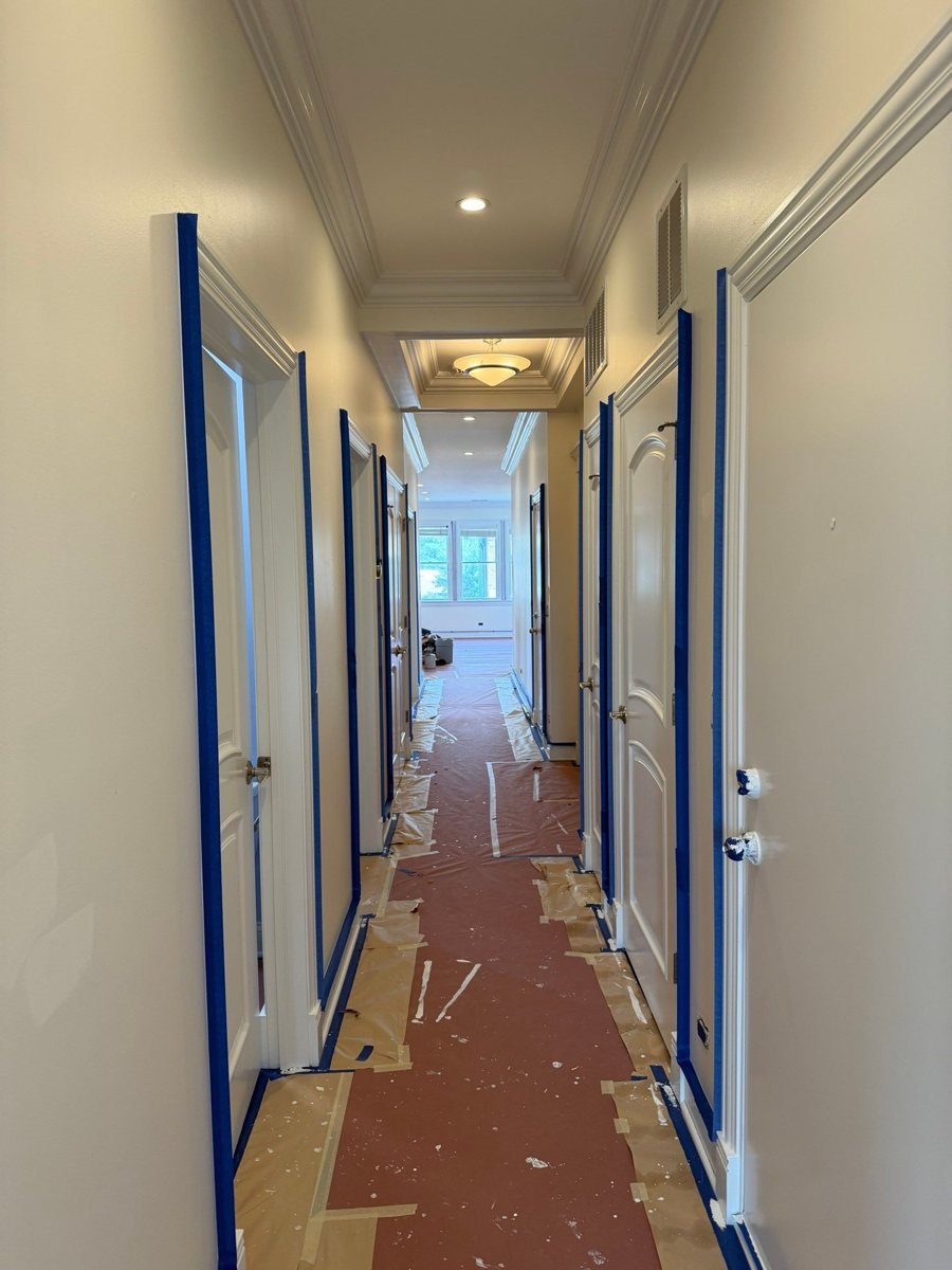 Lincoln Park condo hallway on prep day, doors taped and floors protected