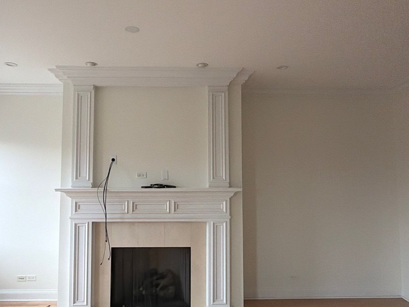 Lincoln Park living room repainted in Sherwin-Williams Alabaster with white fireplace mantel